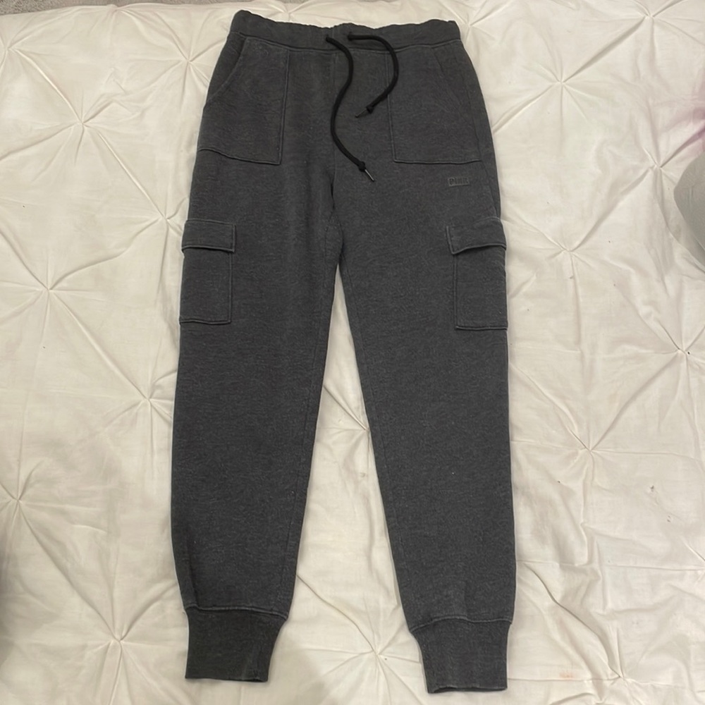 Dark grey PINK cargo joggers with 4 pockets, drawstring, and sleeve cuffs